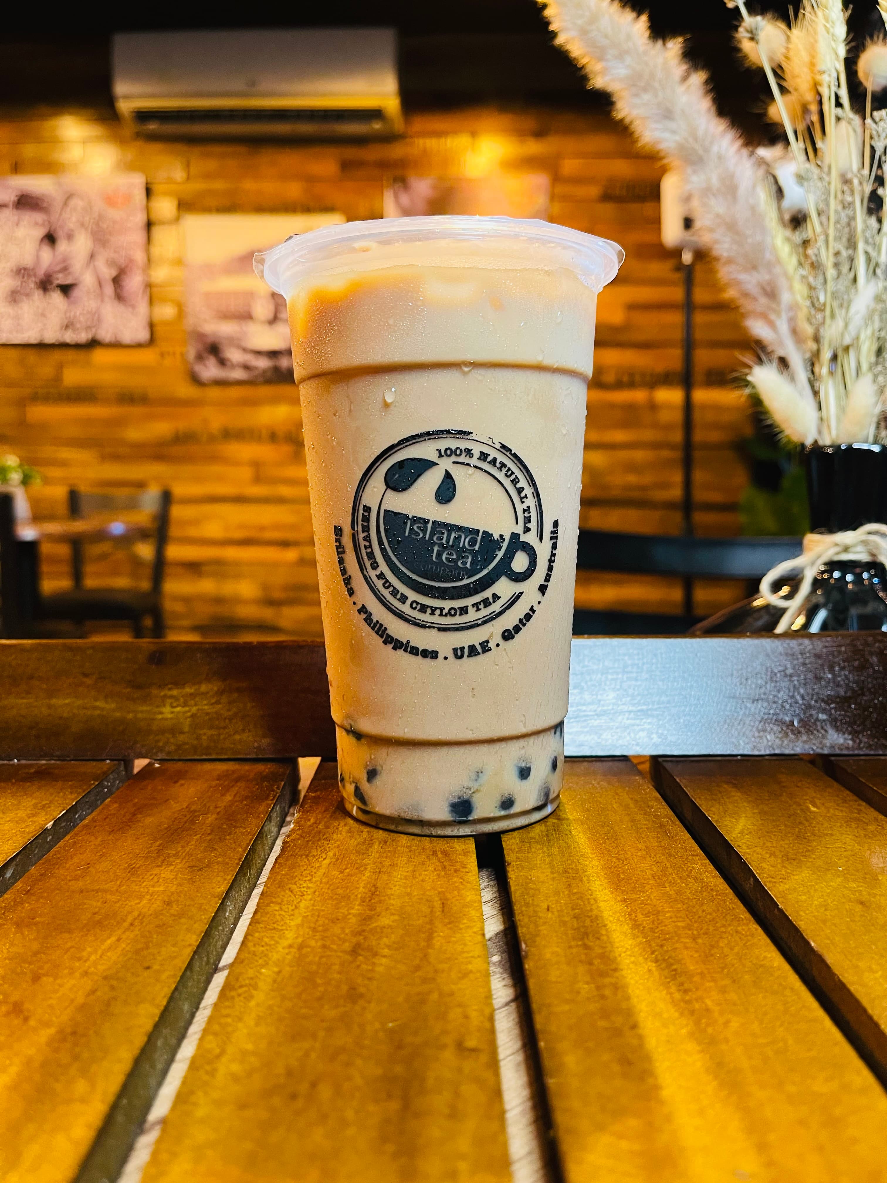 Iced chocolate milk tea in an Island Tea cup